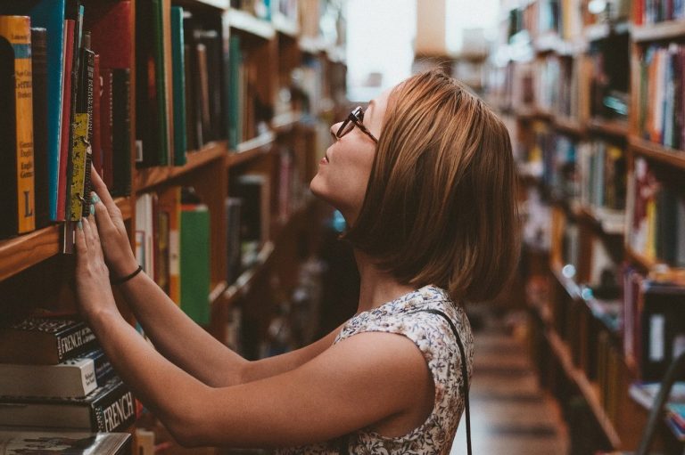 Woman searching for information in an archive 